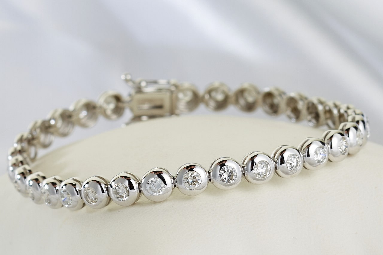 diamond and platinum bracelet on a light background