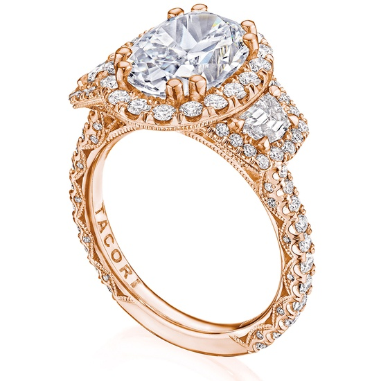 An elegant rose gold ring with a large oval diamond center, encircled by smaller diamonds.