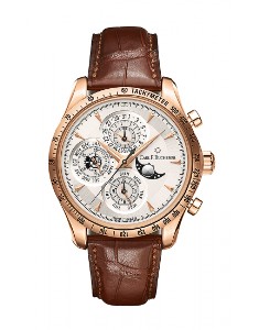 A Carl F Bucherer Manero watch with a rose gold case and alligator leather watch strap and multiple complications.