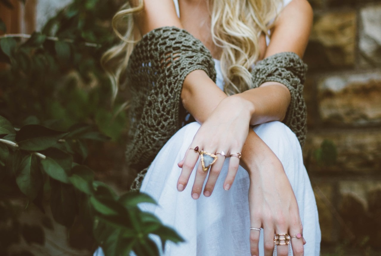 lady with arms crossed wearing fashion rings