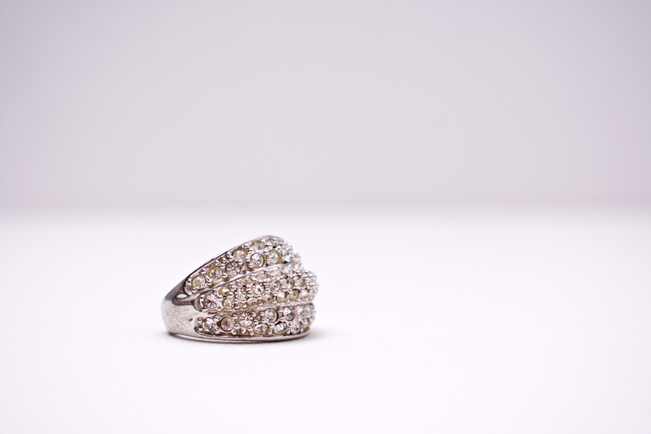 A sparkling white gold three row diamond ring.